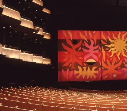 A curtain in the Concert hall with tapestry art on it.