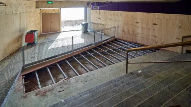 The carpet being stripped from the staircase of the Northern foyer.