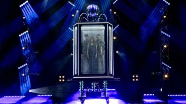 Now You See Me Live Magicians standing in a magic contraption about to perform a trick