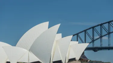 Sydney opera house and the Harbour bridge on a sunny day.