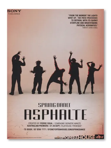 A group of people with their hands up.